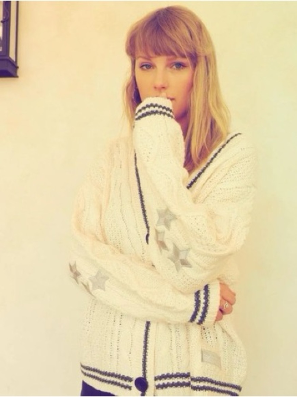 Taylor Swift Cream Cable Knit Cardigan with Black Trim and Lavender Star Patch.